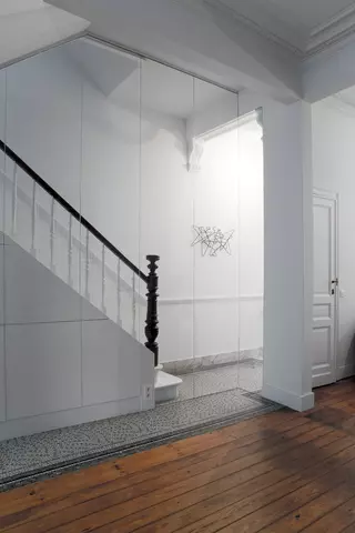 Glass wall between living spaces and hall